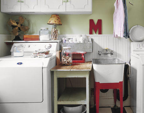 We love mixing old with new consider adding antique pieces into the laundry are for a collected look