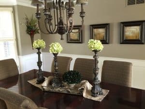 Reuse items in your home. Create a beautiful centerpiece using a tray or scar for a layered look.
